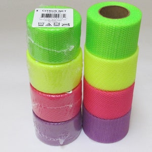May include: A stack of six rolls of neon green, yellow, pink, and purple mesh netting. The rolls are wrapped in plastic and labeled "Citrus Net".