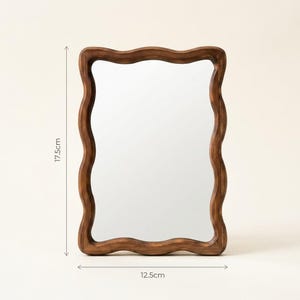 Small wavy wooden mirror size guide, 19 cm tall by 12.5 cm wide, organic irregular mirror with sculptural wood frame.