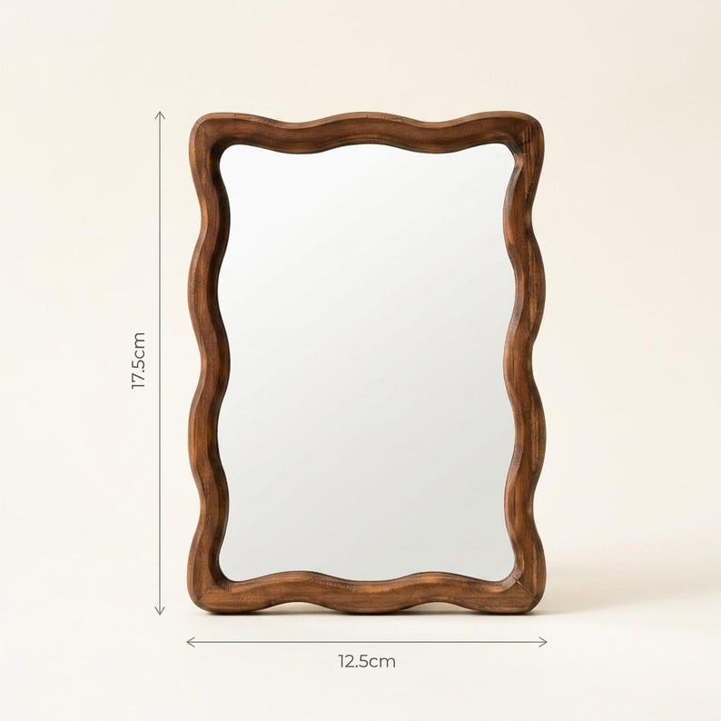 Small wavy wooden mirror size guide, 19 cm tall by 12.5 cm wide, organic irregular mirror with sculptural wood frame.