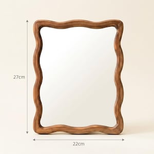 Wavy wooden mirror size guide, 27 cm tall by 22 cm wide, small organic irregular mirror with sculptural wood frame.