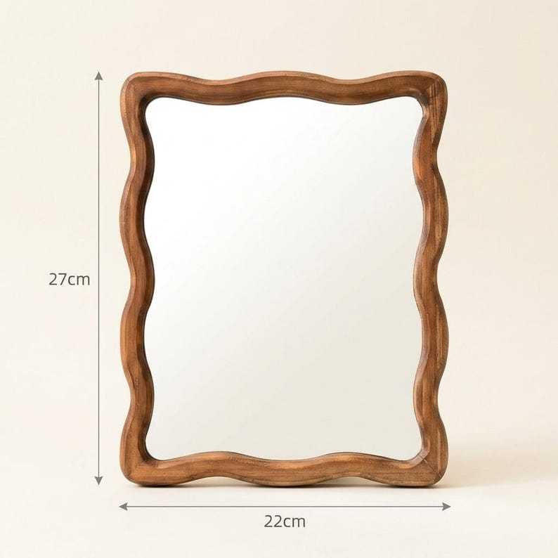 Wavy wooden mirror size guide, 27 cm tall by 22 cm wide, small organic irregular mirror with sculptural wood frame.