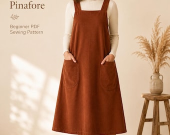 May include: A rust-colored corduroy pinafore dress with a square neckline, wide shoulder straps, and two large front patch pockets. The text on the image reads: Reversible Cross-Back Pinafore, Beginner PDF Sewing Pattern.