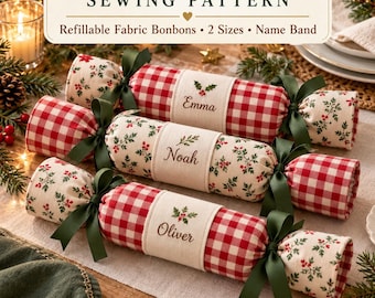 May include: A sewing pattern for a reusable Christmas cracker, featuring three fabric bonbons with red and white gingham or holly patterns, tied with dark green ribbons and personalized with the names Emma, Noah, and Oliver on bands.