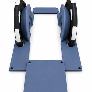 May include: A blue modular frame assembly featuring two black wheels with white accents. The structure consists of two parallel side panels with circular cutouts for the wheels and a rectangular base plate connecting the front sections together.