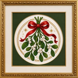 May include: A cross-stitch embroidery of a mistletoe sprig with white berries and green leaves, tied with a red ribbon bow. The design is circular, accented with small gold stars, and framed in an ornate, decorative gold-coloured wooden frame.
