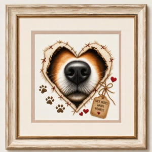 May include: A framed cross-stitch artwork featuring a dog nose centered within a heart-shaped cutout of beige fabric. The design includes brown paw prints, small red hearts, and a hanging tag with the text WET NOSES WARM HEARTS in a wooden frame.