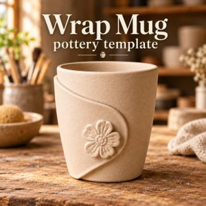 May include: A beige ceramic mug with a wrap-around design and a raised flower relief on the front. The text "Wrap Mug pottery template" is displayed above the mug. The mug has a matte, textured finish and a simple, cylindrical shape.