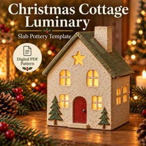 May include: A ceramic house-shaped luminary with a speckled off-white finish, a green roof, and a red door. The structure features cut-out windows and a star, illuminated from within. Text reads: Christmas Cottage Luminary Slab Pottery Template.