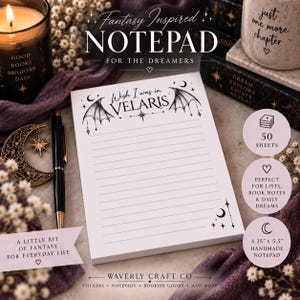 May include: A white rectangular notepad with horizontal lines, featuring black illustrations of bat wings, stars, and a crescent moon at the top and bottom corners. The text reads Wish I was in VELARIS. It includes 50 sheets and measures 4.25 inches by 5.5 inches.
