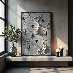 May include: A framed wall art print featuring a textured white impasto background with multiple small figures of skiers in colorful outfits descending a snowy slope. The artwork is displayed in a black frame, capturing the dynamic movement of winter sports.