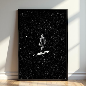 May include: A framed vertical wall art print featuring a black background filled with white stars. A silver-toned humanoid figure stands on a circular silver disc in the centre, depicted in a comic book style with high contrast shading.