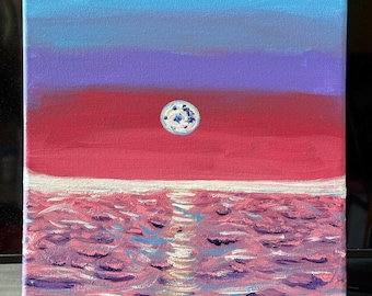 Blue hour past sunset moon lit sky reflecting water