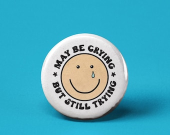May be Crying but Still Trying Pinback Button