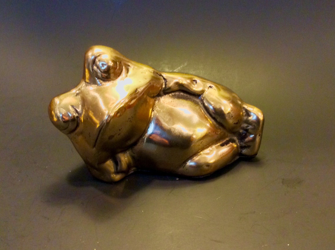 reclining frog statue
