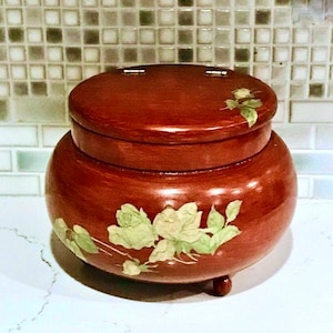 May include: A set of three ceramic vases in varying heights. The vases are white with a textured, ridged design. The tallest vase is approximately 10 inches tall, the medium vase is 8 inches, and the smallest is 6 inches.