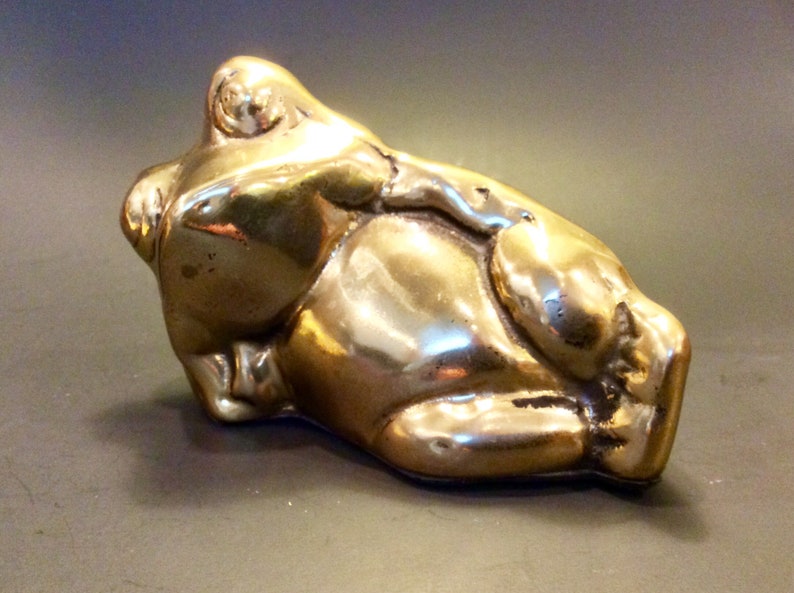 reclining frog statue