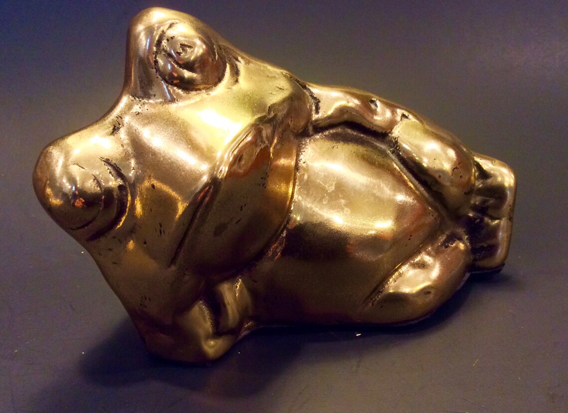 reclining frog statue