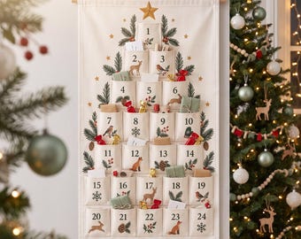 May include: A cream-coloured fabric wall-hanging advent calendar featuring twenty-four numbered pockets arranged in a tree shape. The design includes illustrations of pine branches, berries, and woodland animals. The name Finn is embroidered at the bottom.