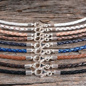 Genuine braided leather necklace with solid sterling silver clasps.