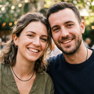 A lifestyle image of a male and female wearing a 2mm black leather necklace.
