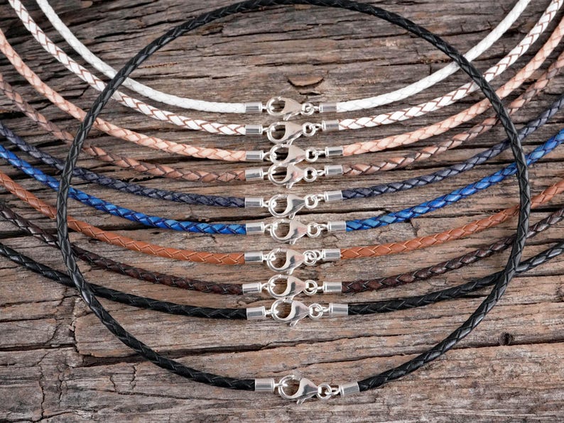 An overview of leather necklace colors along with a round black leather necklace in the center.