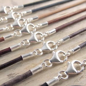 Sterling silver cord findings on leather necklaces handmade by Sepia Tree.