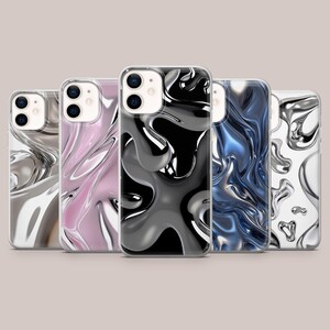 May include: Five smartphone cases arranged in a row, each featuring a distinct liquid metal or molten chrome effect. The designs include silver, pink, black, blue, and white colorways, all showcasing fluid, abstract, and reflective patterns.