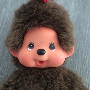 Vintage 1974 Monchhichi Monkey Toy, Brown Eyes, Pink Bottle, Red Ribbon, Sekiguchi Japan