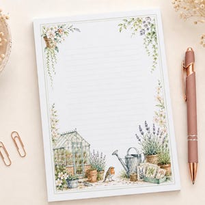 May include: A rectangular sheet of lined stationery featuring a watercolour illustration of a garden scene with a greenhouse, a robin, lavender, and potted plants. The border is decorated with hanging floral vines and greenery in soft pastel tones.