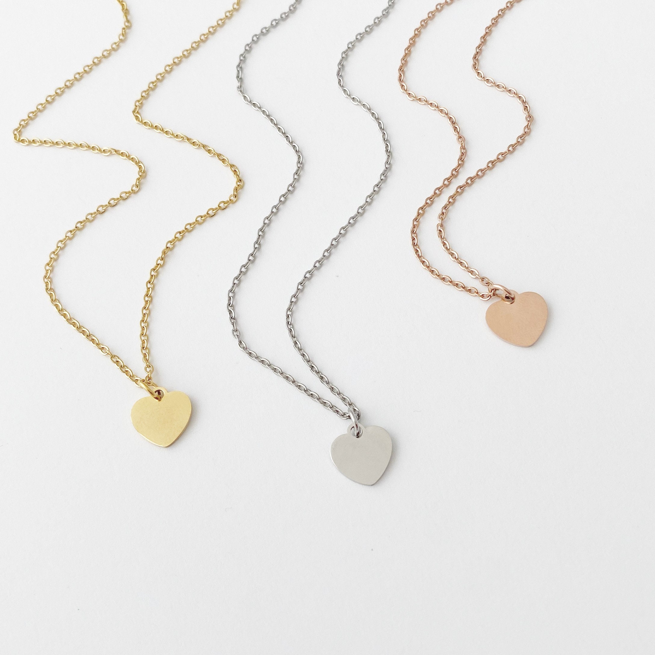 Gold and silver heart best sale necklace