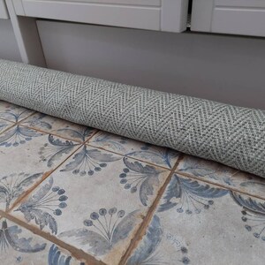 Chunky weighted herringbone fabric pattern in sage green and cream Extra long 135cm Draught Excluder
