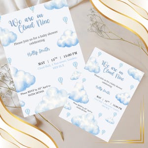 May include: Two white baby shower invitation cards featuring blue watercolor clouds and hot air balloons. The text reads: We are on Cloud Nine, Please Join us for a baby shower celebrating Holly Smith, May 15th, 15:00 PM, Cloud Hall, 1 Sun street, London, SE9 9LX, RSVP by 25th April to 01234 567645.