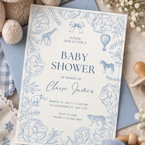 May include: A rectangular baby shower invitation card featuring blue line art illustrations of flowers, a bow, a giraffe, a hot air balloon, a zebra, an elephant, and a tiger. The text reads: PLEASE JOIN US FOR A BABY SHOWER IN HONOR OF Claire James MARCH 13, 2027 12:00 PM 123 ANYWHERE ST, ANY CITY RSVP TO CAM PHONE +123-456-7890.