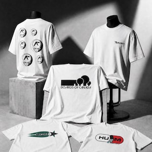May include: Five white short-sleeve t-shirts featuring various graphic prints. One shirt displays multiple circular Aphex Twin logos, another has a small chest logo, one features the Boards of Canada text and tree icon, and two show Hum graphics.