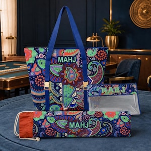 May include: A tote bag, a clear pouch, and a long cylindrical case, all featuring a vibrant, multi-colored paisley pattern on a dark blue background. Each item displays the text "MAHJ" in light green letters. The tote has blue straps.
