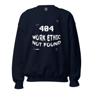 May include: A navy blue crewneck sweatshirt featuring white text that reads 404 WORK ETHIC NOT FOUND. The design includes small graphic elements like a loading bar, arrows, and a question mark, all printed in a distressed, brush-stroke style font.