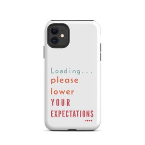 May include: A white smartphone case featuring the text "Loading..." in teal, followed by "please lower YOUR EXPECTATIONS" in a gradient of orange to red, with a small red triangle icon at the bottom right corner of the text block.