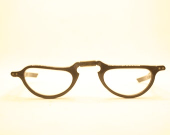 May include: A pair of black, metal, folding spectacles with clear lenses.
