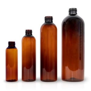 May include: Four amber glass bottles of different sizes with black screw-on caps. The bottles are empty and have a smooth, rounded shape.