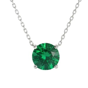 May include: A silver-toned chain necklace featuring a single, round-cut, vibrant emerald green gemstone held in a four-prong setting. The pendant is centered on the delicate metal chain, which displays a classic link design with a polished finish.