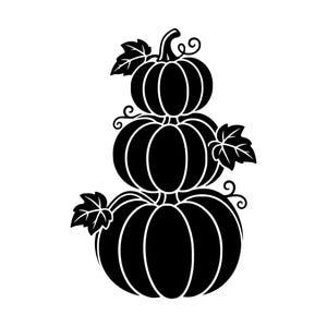 May include: A black silhouette graphic of three stacked pumpkins. The design features a large pumpkin at the base, a medium one in the middle, and a small one on top. Each pumpkin has visible vertical ribs, curly vines, and pointed leaves.