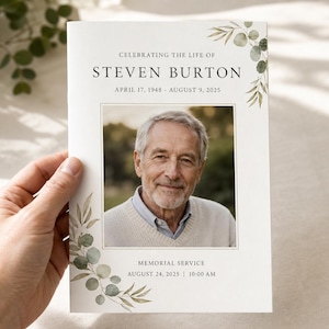Peut inclure: Un programme de service commémoratif blanc avec une photographie centrale d'une personne âgée. Le texte indique Celebrating the Life of Steven Burton, April 17, 1948 - August 9, 2025, Memorial Service, August 24, 2025, 10:00 AM, avec des feuilles aquarelles vertes.