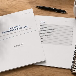 May include: A white booklet titled The Complete Interview Do's & Don'ts Guide by Self Help GB, displayed alongside an open page showing a contents list, a black pen, a spiral-bound notepad with handwritten interview tips, and a coffee mug.