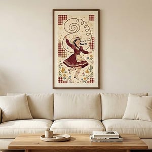 Burgundy folk cowgirl art print framed above a cream sofa in a living room — western wall decor, printable digital download