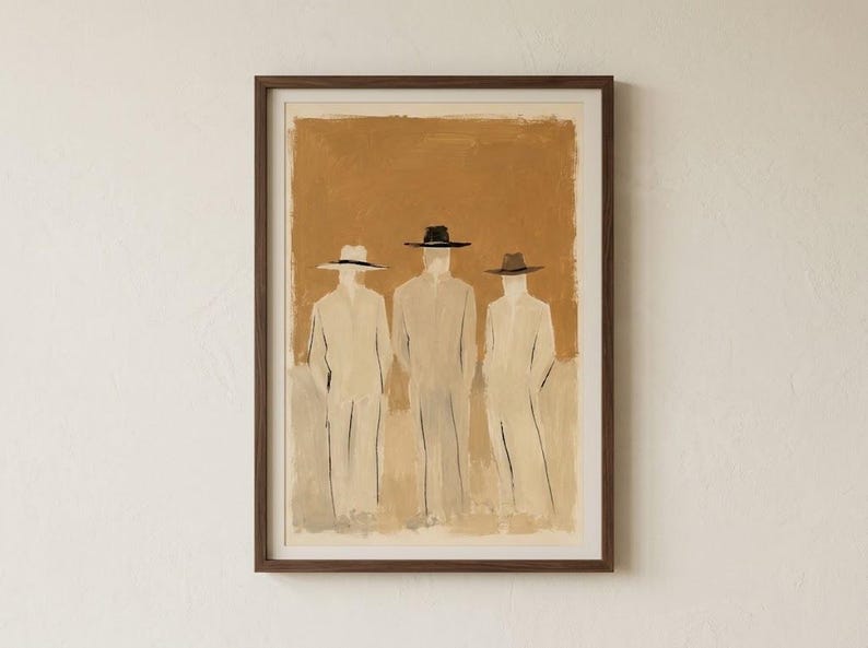 May include: A framed wall art print featuring a painting of three figures wearing wide-brimmed hats and long coats. The figures are rendered in shades of beige and cream against a solid, textured ochre-brown background within a dark wood frame.