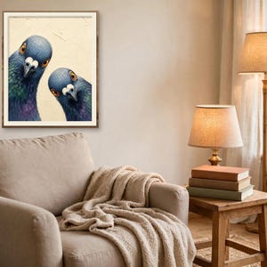 May include: A framed wall art print featuring two pigeons with iridescent blue, green, and purple neck feathers and orange eyes, set against a textured cream background, looking directly forward with curious expressions.