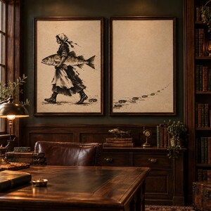 May include: Two framed wall art prints featuring a monochromatic ink-style illustration. The left print depicts a person in a headscarf and boots carrying a large fish. The right print shows a trail of footprints leading across a blank background.
