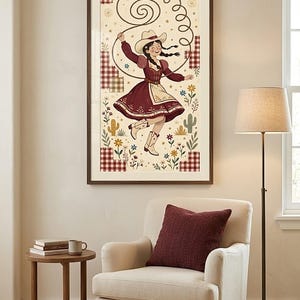 Dancing cowgirl art print above a reading armchair with a burgundy cushion — folk art print for a reading nook or study, printable wall art