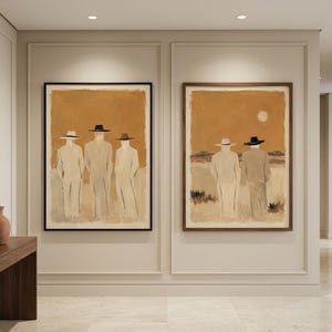 May include: Two framed wall art prints featuring abstract figures in light-coloured suits and hats against a warm ochre background. The left print shows three figures standing, while the right print depicts two figures in a landscape with a pale sun.