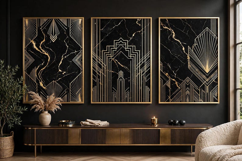 May include: A set of three rectangular wall art prints featuring black marble backgrounds with gold geometric line patterns, each encased in a thin gold frame. The artwork displays symmetrical, angular designs with radiating fan-like motifs.